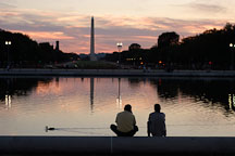 Friends sitting by the Capitol reflecting pool. Washington Monument. Washington, D.C. - Photo #1835