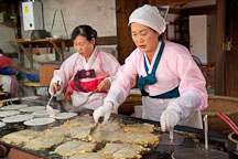 These women are preparing haemul pajeon, Korean pancakes filled green onions and seafood. - Photo #20535
