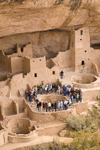 Crowd of visitors surround a kiva at Cliff Palace. Mesa Verde, Colorado. - Photo #18537
