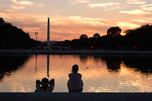 Couple relaxing in front of the Capitol reflecting pool. Washington, D.C. - Photo #1838
