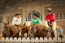 Competitors talking during break at the cowby mounted shooting competition. Iowa State Fair, Des Moines. - Photo #33040