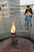 The Torch of Peace, an eternal flame, burns at the base of the World Peace Gate at Olympic Park in Seoul, South Korea. - Photo #21640