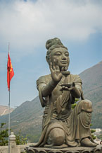 Buddhist statues praising the Tian Tan Budha. Lantau Island, Hong Kong, China. - Photo #16041