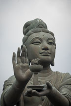 Buddhist statues praising the Tian Tan Budha. Lantau Island, Hong Kong, China. - Photo #16042