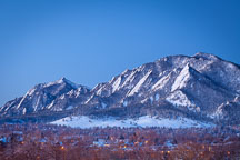 Flatirons and the city of Boulder in winter just before sunrise. Boulder, Colorado. - Photo #33142