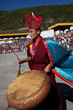 Monk beating large drum. Thimphu tsechu, Bhutan. - Photo #22443