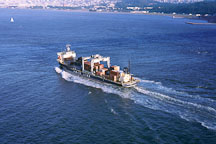 Cargo shipping passing under Golden Gate Bridge. San Francisco, California. - Photo #43