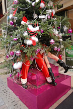 Santa Claus and girl under a christmas tree. Lan Kwai Fong. Hong Kong - Photo #15044