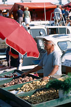 Man selling produce from boats. Kauppatori, Helsinki, Finland. - Photo #445