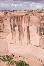 The canyon wall towers above Antelope House. Canyon de Chelly, Arizona. - Photo #18346