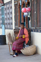 Old woman with hand held prayer wheel. Paro, Bhutan. - Photo #24351