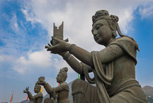 Buddhist statues praising the Tian Tan Budha. Lantau Island, Hong Kong, China. - Photo #16057