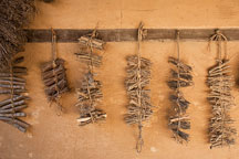 Bundles of sticks hang outside a traditional home in the Korean Folk Village. - Photo #20458