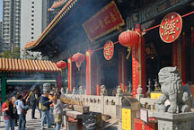 Chinese people gather to light incense. Wong Tai Sin Temple, Hong Kong, China. - Photo #15706
