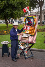 Old man with monkey working as a busker. Miraflores, Lima, Peru. - Photo #8761