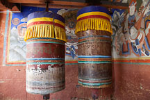 Large prayer wheels at the entrance to Wangdue Dzong. - Photo #23662