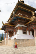 Khamsum Yuelley Namgyal Chorten and old woman. Punakha valley, Bhutan. - Photo #23366