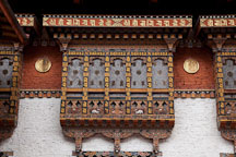 Windows on the walls of the southernmost courtyard at Punakha Dzong. Punakha, Bhutan. - Photo #23467