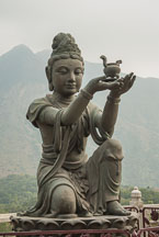 Buddhist statues praising the Tian Tan Budha. Lantau Island, Hong Kong, China. - Photo #16068