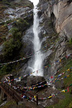 A bridge takes travelers past the Shelkar Zar waterfall to Taktshang. Paro Valley, Bhutan. - Photo #24169