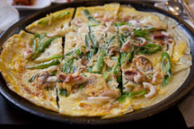 Haemul pajeon (seafood pancake) with green onions is a popular Korean dish. - Photo #20869
