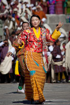 Woman singing and performing a folk dance. Thimphu tsechu, Bhutan. - Photo #22707