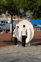 Teenage boys experimenting with a parabolic dish at the Maryland Science Center. Baltimore, Maryland, USA. - Photo #3971