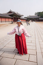 A tour guide speaks to visitors at Changdeok Palace in Seoul, South Korea. - Photo #21472