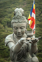 Buddhist statues praising the Tian Tan Budha. Lantau Island, Hong Kong, China. - Photo #16085