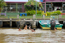 Children playing in the water. Toruguero village, Costa Rica. - Photo #13986