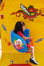 Girl on ride. Chinatown, Los Angeles, California, USA. - Photo #6886