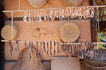 Herbs and spices hang outside a small home to dry in the sun. - Photo #20488