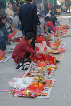 Visitors to the Wong Tai Sin Temple prepare a food offering. Hong Kong, China. - Photo #15688