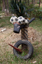 Odd figure made from soccer balls, tires, and a wood stake. Punakha, Bhutan. - Photo #23309