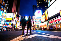 Couple walking in the middle of the street. Times Square, New York City, New York, USA. - Photo #13091