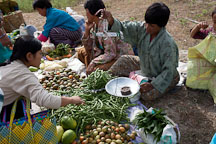 Woman purchasing green beans at the weekend market in Punakha. - Photo #23293