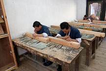 Students working in a wood carving classroom. National Institute for Zorig Chusum, Thimphu, Bhutan. - Photo #22896
