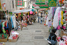 Clothing and costume vendors line the sides of Pottinger street. Hong Kong, China. - Photo #16398
