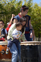 Mother and son trying Taiko drums. Cherry blossom festival. Japantown, San Francisco, California, USA. - Photo #3598