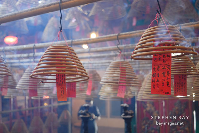 Man Mo Temple is filled with smoke from burning incense. Hong Kong, China
