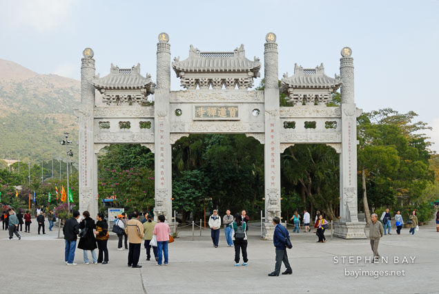 Stone archway gate. Po Lin Monastery, Ngong Ping, Lantau Island, Hong Kong, China.
