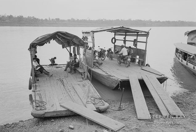 Boat with wide deck used for transportation in Puerto Maldonado.