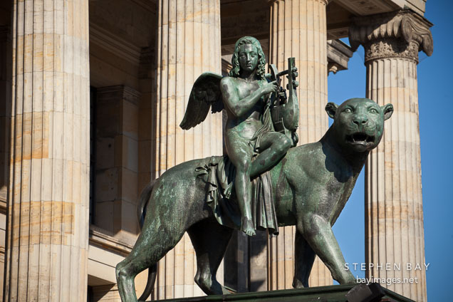 Statue, panther with the genius of the music on the Konzerthaus Berlin.