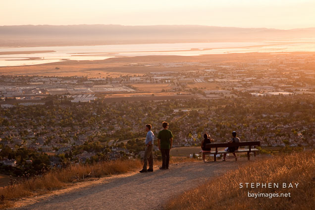 Hikers watching the sunset over the Bay Area. Mission Peak, California.