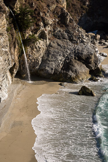 The waterfall at McWay Cove is one of two waterfalls in California that flow directly into the ocean. Big Sur, California, USA.