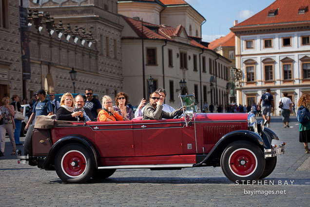 Skoda car and tourists. Prague, Czech Republic.