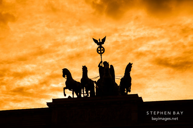 Silhouette of Quadriga, a four horse chariot driven by the goddess Victoria.
