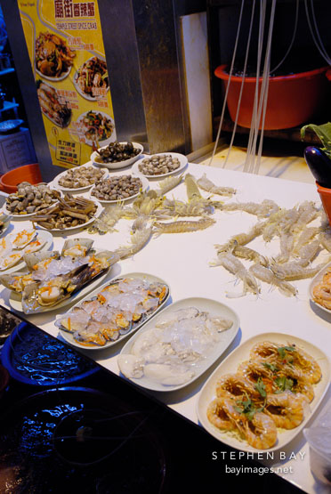 Assortment of seafood, some still live, at a restaurant. Temple Street, Hong Kong, China.