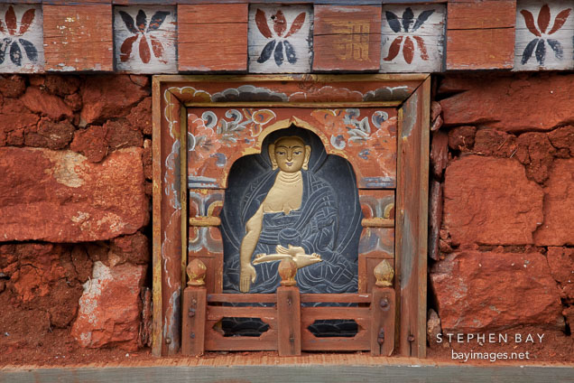 Carved slate panel showing a Buddha on one of the 108 Chortens at Dochu La, Bhutan.