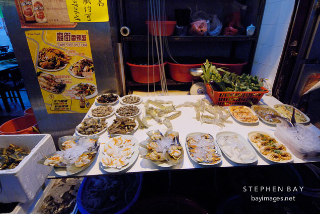 An assortment of shellfish available at a Temple street restaurant. Kowloon, Hong Kong, China.